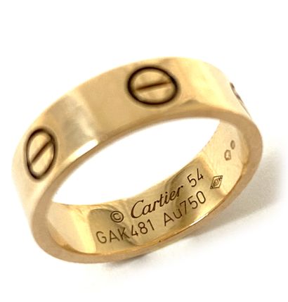 null "CARTIER ""Love"" ring holding a drawing of nuts. Mounted in 18K pink gold....