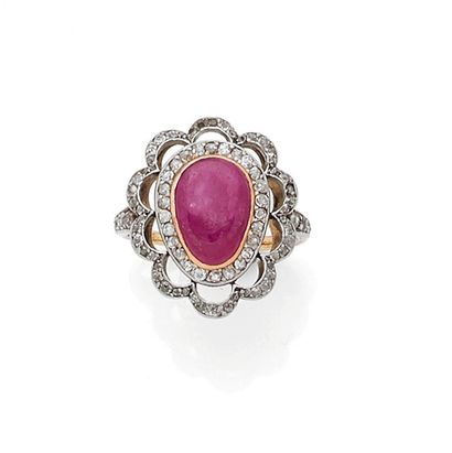 null RING set with a cabochon ruby in a setting of old cut and rose cut diamonds....