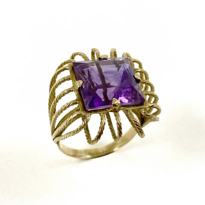 null RING holding an amethyst of 7 carats approximately square in a decoration of...