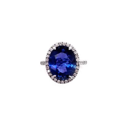 null RING holding an oval tanzanite of 5.54 carats in a setting of brilliant-cut...