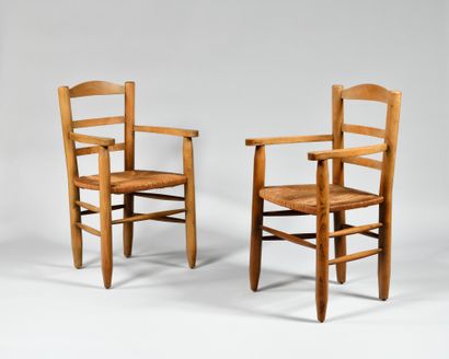 null WORK OF THE 1950's In the style of Charlotte Perriand Pair of beechwood armchairs,...