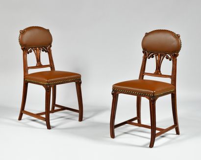 null LEON BENOUVILLE (1860-1903) Pair of chairs in rosewood carved with plants, upholstered...