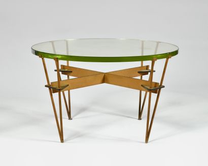 null In the style of FONTANA ARTE Low table with thick circular glass top, on four...