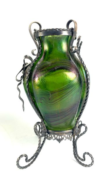 null Attributed to LOETZ Curved vase with straight neck in iridescent wavy glass...