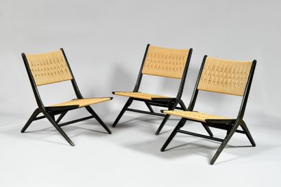 null WORK OF THE 1960S Suite of three folding chairs with profiled black lacquered...