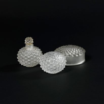 null RENE LALIQUE " Cactus " Set in pressed molded glass including a spherical bottle...
