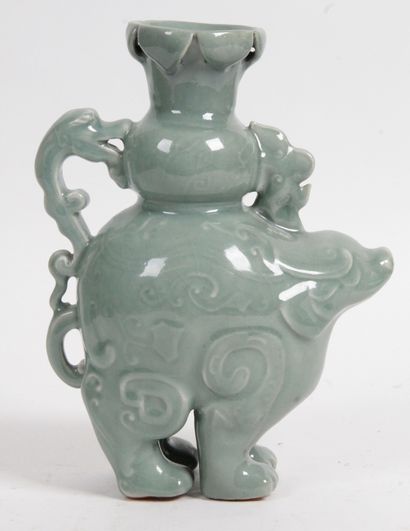 null CHINA, 20th CENTURY Celadon enameled porcelain jug in the form of a stylized...