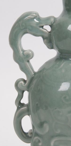 null CHINA, 20th CENTURY Celadon enameled porcelain jug in the form of a stylized...