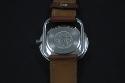 null HERMES Arceau. Circa 2010. Steel bracelet watch, round case, signed white dial....