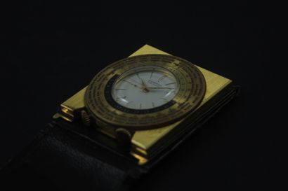 null DUNHILL About 1960. Worldtime travel clock. Bedside clock in gilded brass linked...