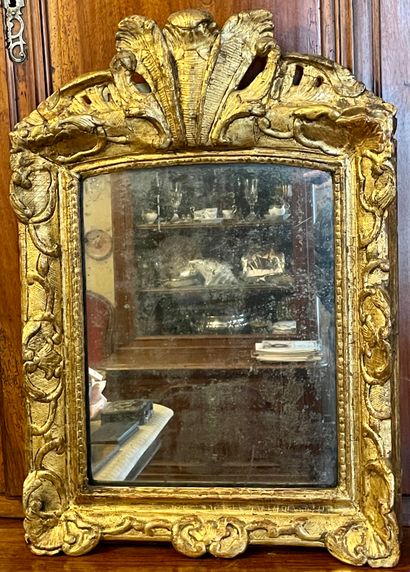 Gilded wood mirror molded and carved with...