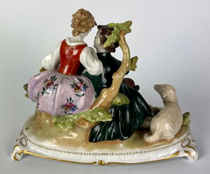 null GERMANY Three groups in polychrome porcelain decorated with gallant scenes....
