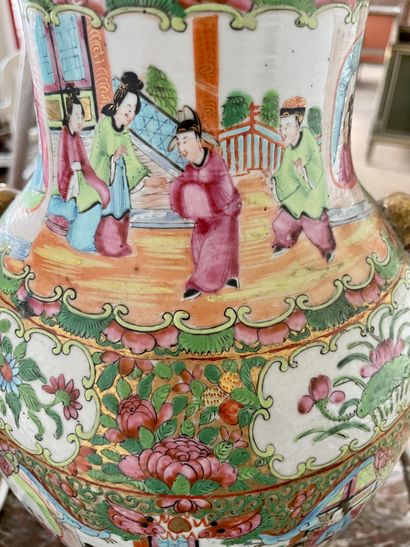 null CHINA Pair of Canton enameled porcelain covered vases decorated with palace...