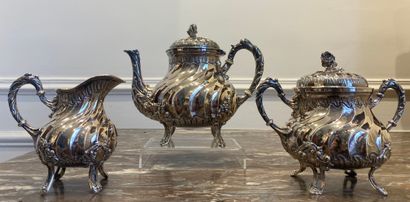 null TEA SERVICE in silver with twisted ribs including a teapot, a covered sugar...