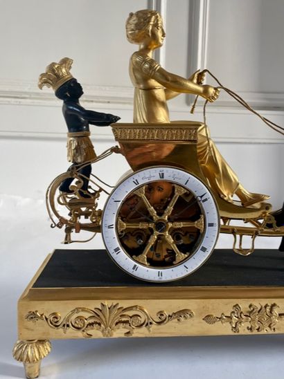  PENDULE IN A CHARTER " allegory of Louisiana ". In chased bronze, gilded and patinated,...