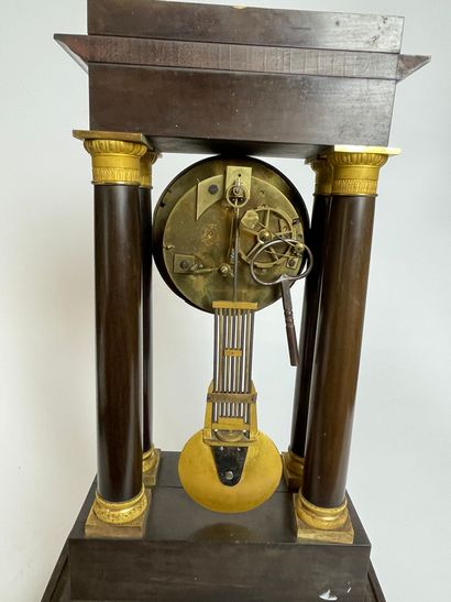 null PORTICAL HANGER in mahogany veneer, the gilt dial set in a temple with four...