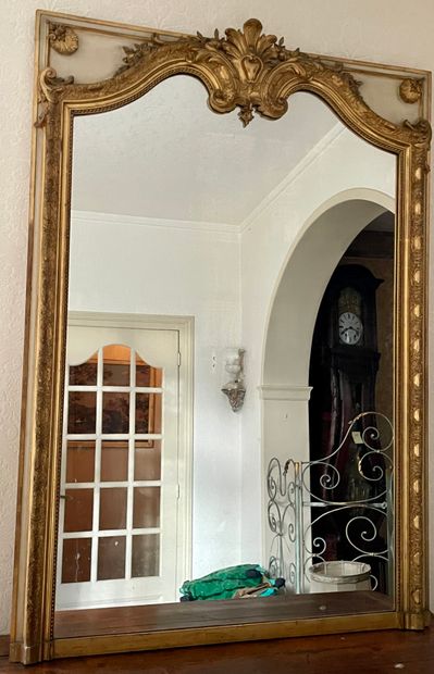null LARGE MIRROR made of cream and gilded wood with scrolled decoration of foliage...