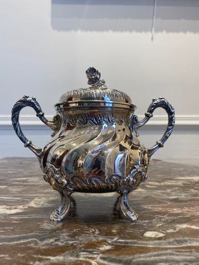 null TEA SERVICE in silver with twisted ribs including a teapot, a covered sugar...