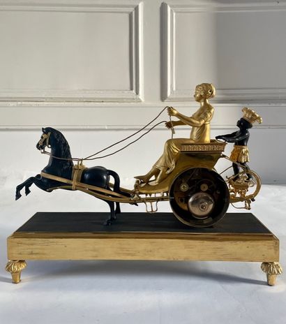  PENDULE IN A CHARTER " allegory of Louisiana ". In chased bronze, gilded and patinated,...