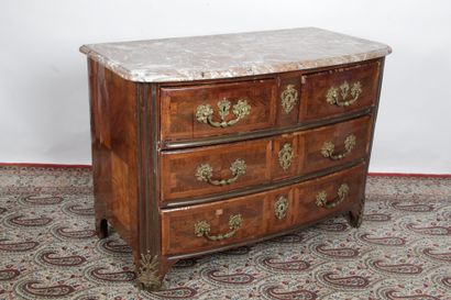 null CINTERED FAACE COMMODE, made of wood veneer in foliage. It opens to four drawers...