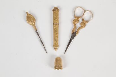 null GOLD SEWING KIT. A thimble. A pair of scissors. A punch. A needle case. Gross...