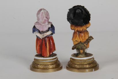 null TWO CHARACTERS "Begging children" polychrome porcelain. On a gilded metal base...