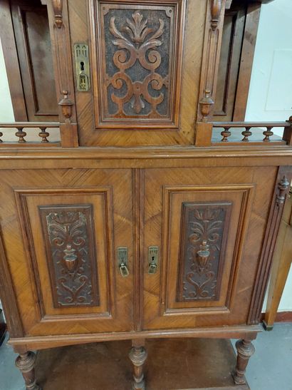 null DESSERTE in molded and carved walnut veneer opening by 3 doors. 

Henri II style

H...