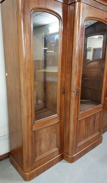 null LARGE LIBRARY in mahogany veneer opening by 3 glass doors discovering 4 drawers...