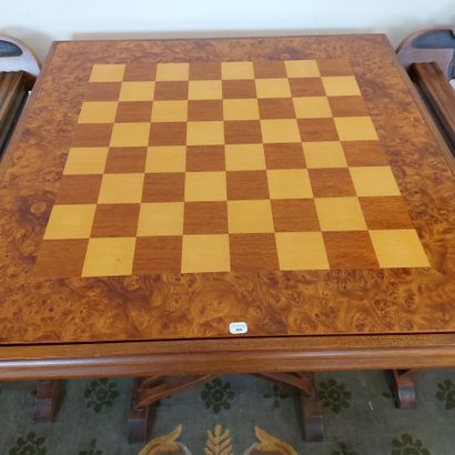 null GAME TABLE AND ITS PAIR OF CHAIRS DAGOBERT in carved wood, armrests lions heads....