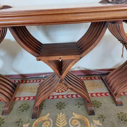 null GAME TABLE AND ITS PAIR OF CHAIRS DAGOBERT in carved wood, armrests lions heads....