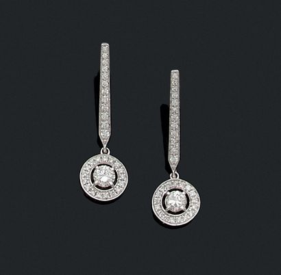 PAIR OF EARRINGS adorned with a line of brilliant-cut...