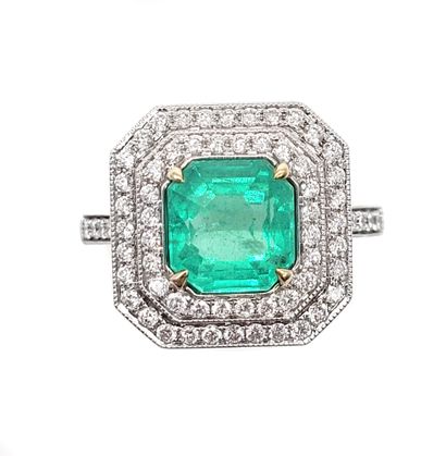 RING holding a square emerald of approximately...