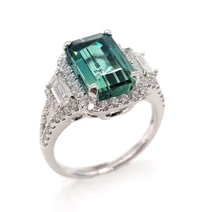 RING composed of an emerald-cut tourmaline...