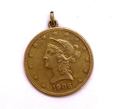 PENDANT holding a coin with the Liberty of...