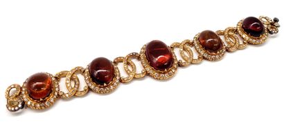 null BRACELET composed of a succession of amber cabochons in a decoration of interlacing...