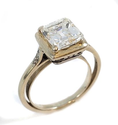null Emerald cut diamond on paper of 3.26 carats. It is accompanied by its 18K white...