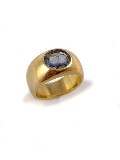 HORSE RING holding a blue stone in initial...