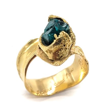 ROLAND SCHAD RING adorned with a raw dioptase....