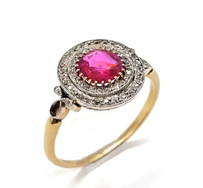 ART DÉCO RING holding a round Burmese ruby...