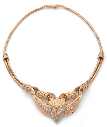 null TRANSFORMABLE NECKLACE adorned with a design of scrolls and plant decoration...