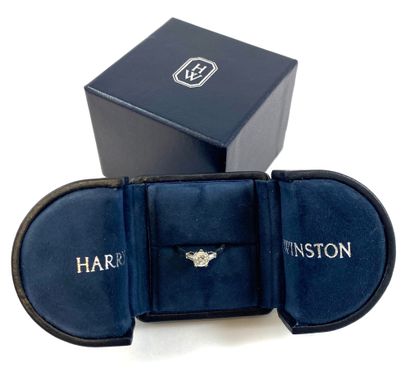 null HARRY WINSTON RING holding a 1.03 carat cushion diamond (E color, VS1 clarity)...