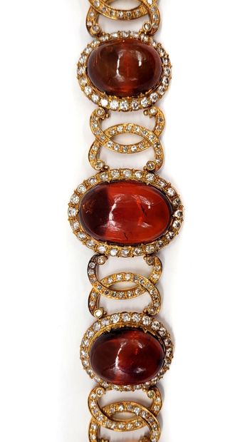 null BRACELET composed of a succession of amber cabochons in a decoration of interlacing...