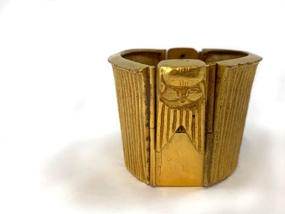 null LINE VAUTRIN BRACELET in gilt bronze. Egyptian and linear decoration. Signed...