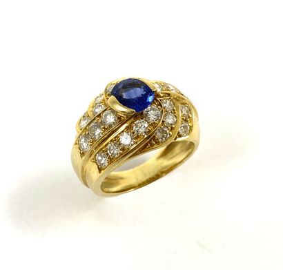 null RING set with an oval sapphire of about 0.75 carat in a line of brilliant-cut...