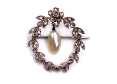 null BRACKET adorned with a plant design paved with rose-cut diamonds holding in...