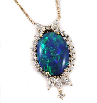 null NECKLACE decorated with a floral design holding in its center a blue opal of...