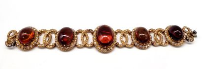 null BRACELET composed of a succession of amber cabochons in a decoration of interlacing...