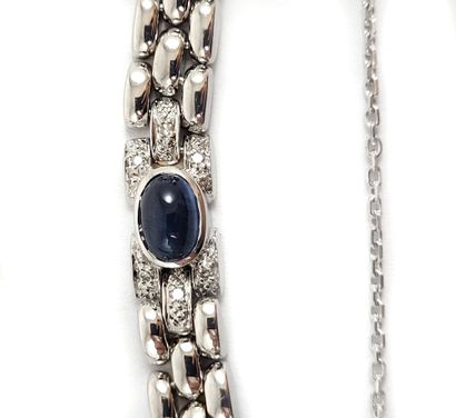 null BRACELET composed of three lines of oval links punctuated with cabochons of...