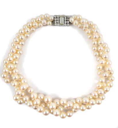 null NECKLACE holding three strands of white pearls (not tested) in fall. The clasp...