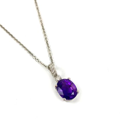 null PENDANT holding an amethyst of about 2 carats held by a hoop paved with 5 brilliant...